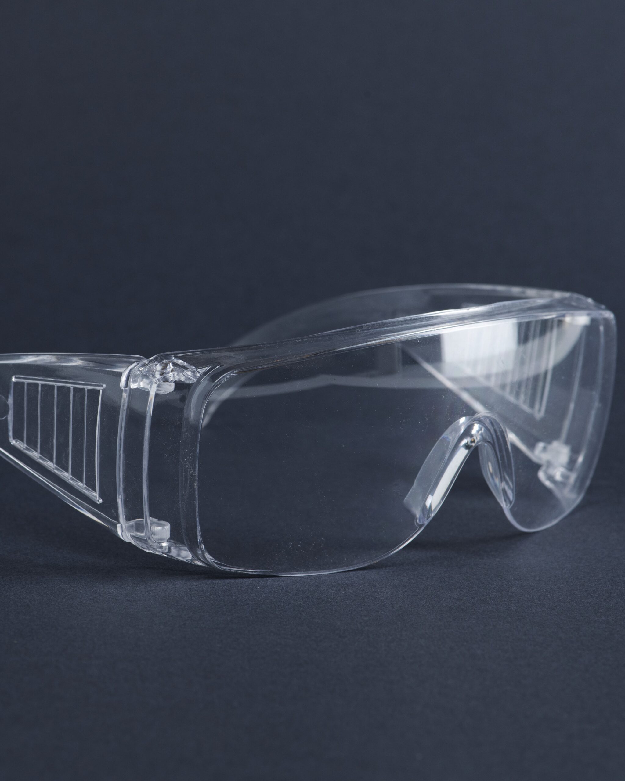 Clear goggles on a dark blue background